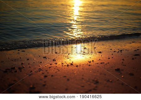 Golden dawn over the beach .Rawa island Malaysia . Selected focus on center .