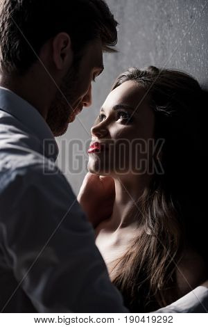 Young Sensual Couple Able To Kiss While Standing Near The Wall