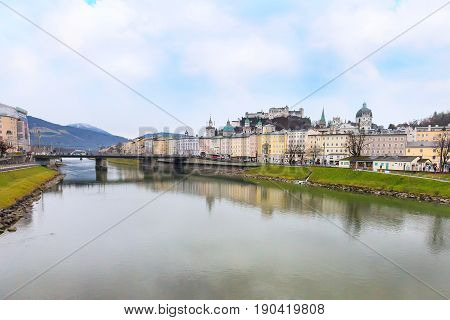 Salzburg, Austria - December 25, 2016: Historic city of Salzburg with Cathedral and Hohensalzburg Festung castle across Salzach river