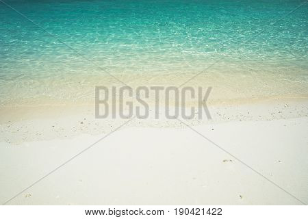 Beach tropical with white sandy and crystal water seen from above. Rawa island Malaysia .