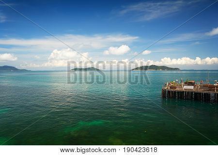 Traveler have fun on the jetty of the port in the sunny day Rawa island Malaysia .