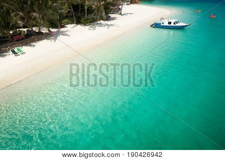Beautiful beach aerial view over a Rawa island. White sandy beach seen from above. Malaysia .