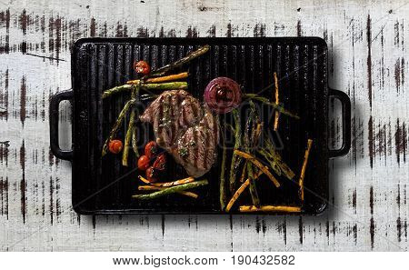 Ancho Steak With Grilled Vegetables On The Grill