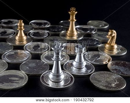 Silver chessboard silver and gold chess silver coins with black background