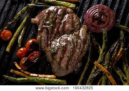 Ancho Steak With Grilled Vegetables On The Grill