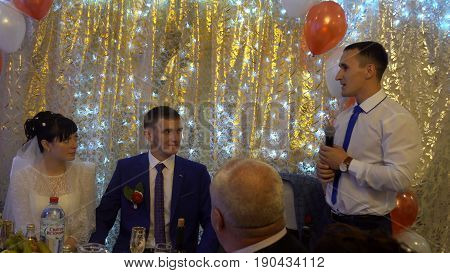Kursk, Russia - June 3, 2017: witness congratulates the newlyweds