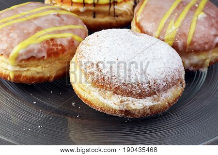 German Donuts - Berliner With Jam And Icing Sugar In A Tray On A Grey Background.