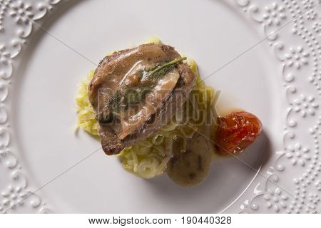 Saltimbocca Veals In Rich Neapolitan Sauce And Tagliatelle Pasta