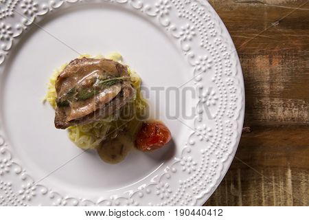 Saltimbocca Veals In Rich Neapolitan Sauce And Tagliatelle Pasta