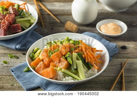 Raw Organic Salmon Poke Bowl with Rice and Veggies