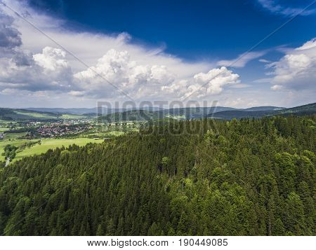 Aerial View Of The Summer Time In Mountains Near Stronie Slaskie Town In Poland. Pine Tree Forest An
