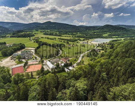 Aerial View Of The Summer Time In Mountains Near Stronie Slaskie Town In Poland. Pine Tree Forest An