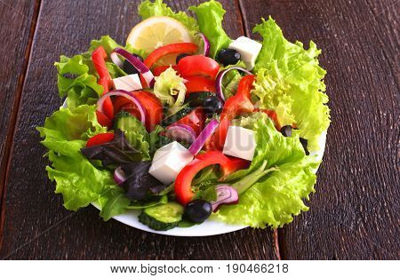 Fresh vegetables on wooden and blur background.