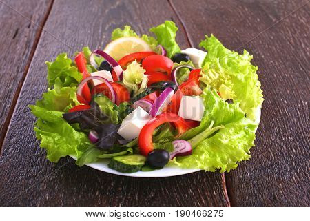 Fresh vegetables on wooden and blur background.