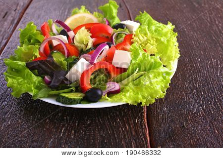 Fresh vegetables on wooden and blur background.