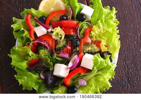Fresh vegetables on wooden and blur background.