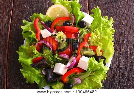 Fresh vegetables on wooden and blur background.