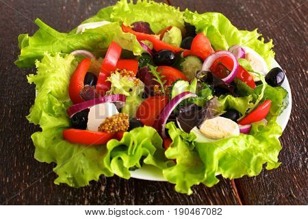 Fresh vegetables on wooden and blur background.