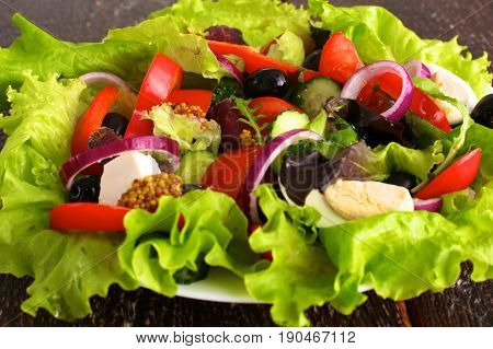 Fresh vegetables on wooden and blur background.