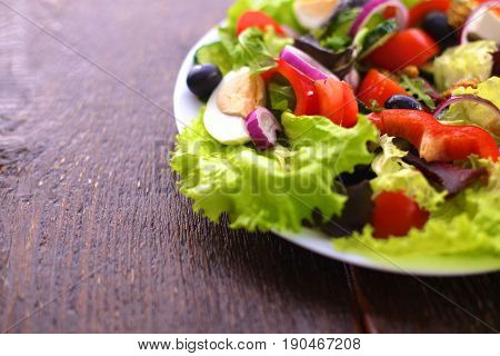 Fresh vegetables on wooden and blur background.