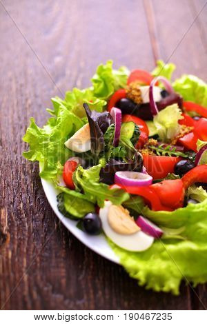 Fresh vegetables on wooden and blur background.