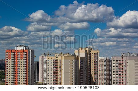 cityscape. new modern housing in urban city against the background of the blue sky and clouds