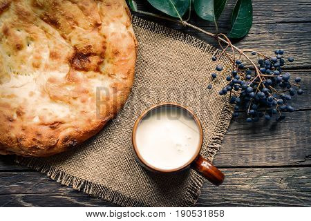 Pita flatbread,. traditional asian bread on wooden background