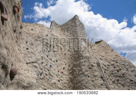 Outdoor artificial climbing wall on a nice day