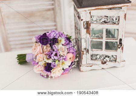 beautiful Wedding bouquet of fresh violet flowers on a white background. Wedding decor concept.