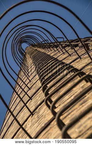 Low View Of The Ladder Of An Old Factory's Chimney