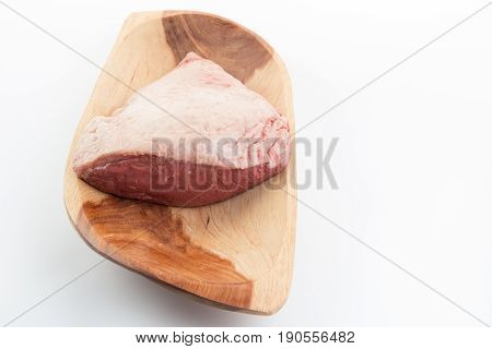 Top View Of A Full Piece Of Raw Cow Beef (picanha) On A Wood Rectangular Bowl Isolated On White Back
