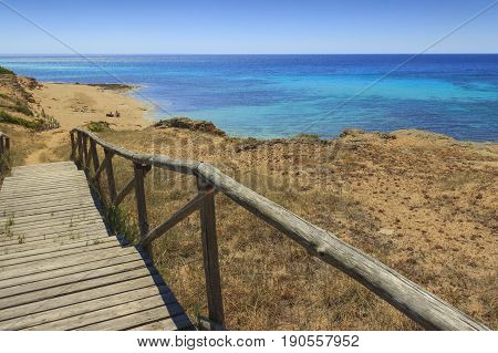 The most beautiful beaches of Italy. Campomarino dune park: fence between sea dunes,Taranto (Apulia). The protected area extends along the entire coast of the town of Maruggio.