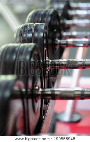 Row of spinlock dumbbels in special rack