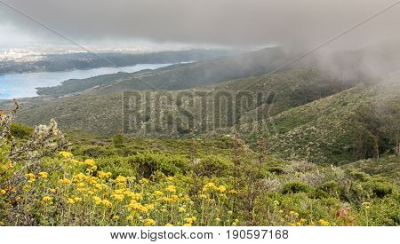 Fog Rolling In On Crystal Springs Reservoir. Sweeney Ridge, San Mateo County, California, USA.