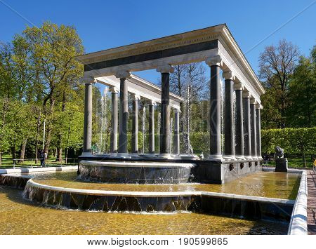 The Lion Cascade fountain. Another name is the Hermitage. It is a pool with waterfall ledges of pudost stone, decorated with two bronze sculptures of guard lions. Peterhof, Russia.