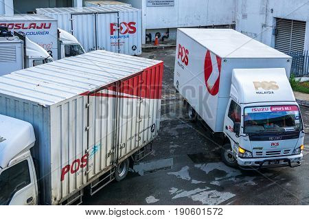 Kota Kinabalu,Sabah-May 27,2017:Poslaju Express trucks on a parking lot in Kota Kinabalu,Sabah,Malaysia.Pos Laju is the leading courier company & has the widest network coverage & the largest courier fleet in Malaysia.
