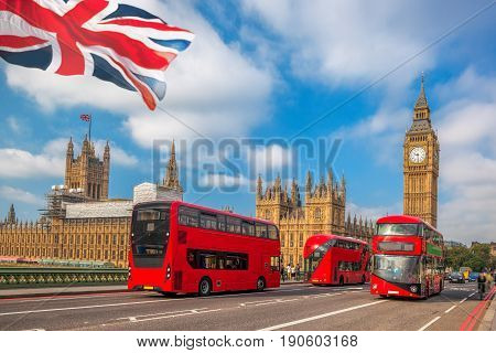 London With Red Buses Against Big Ben In England, Uk
