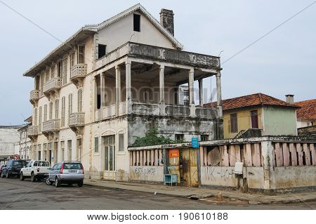 SAO TOME, SAO TOME AND PRINCIPE - FEBRUARY 1, 2017: Colonial buildings in Sao Tome city during the evening hours on February 1, 2017 in Sao Tome and Principe, Africa