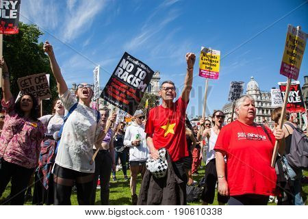 London, UK - June 10 2017: Unidentified protesters  at Westminster Palace expressing their anger at Theresa May's government and her alliance with the Democratic Unionist Party, London, UK