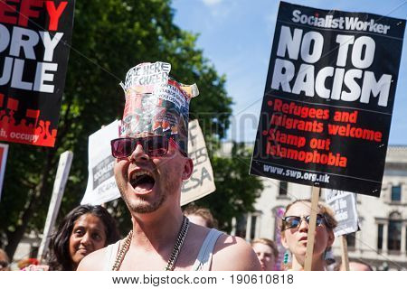London, UK - June 10 2017: Unidentified protesters  at Westminster Palace expressing their anger at Theresa May's government and her alliance with the Democratic Unionist Party, London, UK