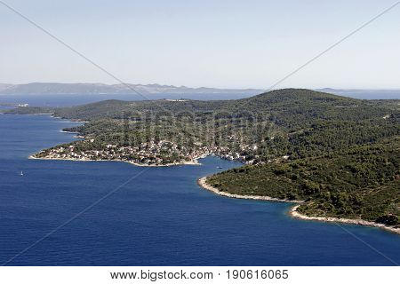 Village Sromorska on green island Solta in blue Adriatic sea in Croatia