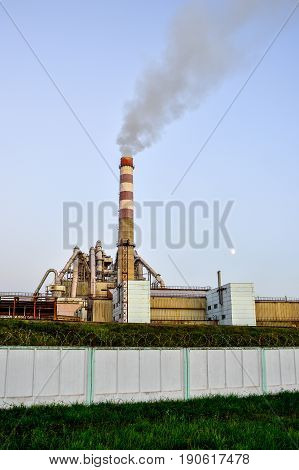 Pollution of atmospheric air from the chimneys of plants.