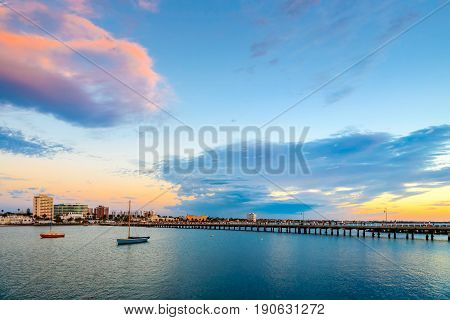 Evening view of St. Kilda Beach jetty at sunset on a hot summer day Melbourne Victoria