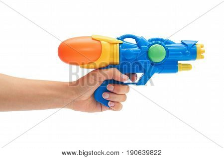 Female Hand Holds Blue Squirt Gun. Isolated On White Background