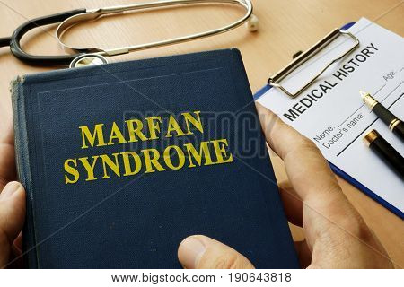 Book with title Marfan Syndrome on a table.