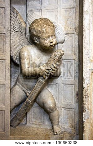 Stone sculpture of Angel on the wall of new chapel in Trogir Cathedral of saint Lawrence