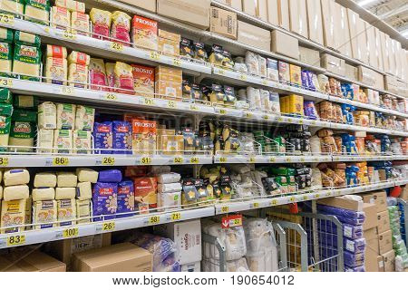 RUSSIA, MOSCOW, JUNE 11, 2017: Different types of ereals on the shelves in the supermarket Auchan.