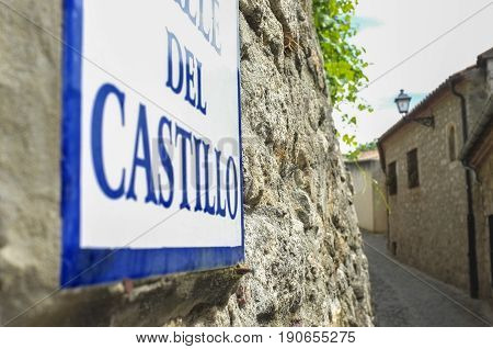 Street sign at stone houses of Trujillo street Extremadura Spain. Old town