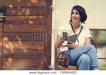 Woman holiday lifestyle writing dairy relax at cafe