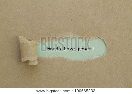 WORDS HAVE POWER word written under torn paper .